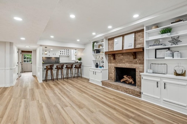6124 Kings Mountain Ct, Stone Mountain, GA 30087 - living area featuring light wood finished floors, a fireplace, crown molding, and recessed lighting