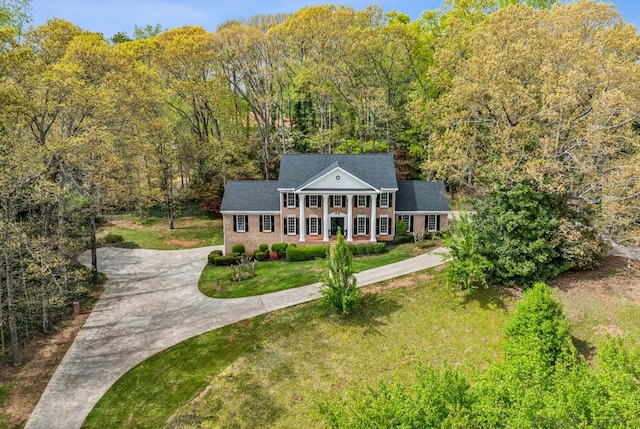 6124 Kings Mountain Ct, Stone Mountain, GA 30087 - birds eye view of property featuring a wooded view