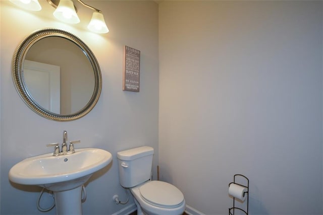 bathroom featuring sink and toilet