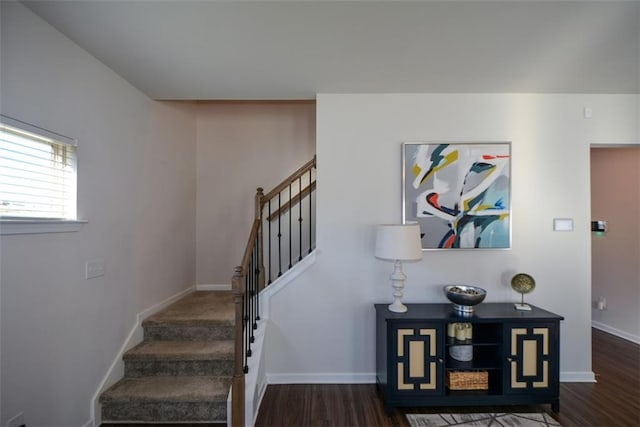 stairs featuring wood-type flooring