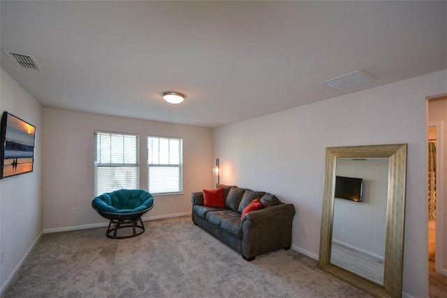 living room featuring light carpet