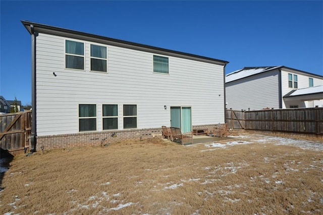 back of house featuring a yard