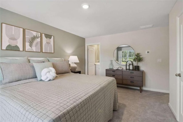 bedroom featuring light carpet