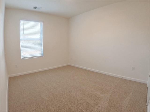 spare room featuring carpet flooring