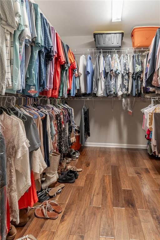 spacious closet with wood finished floors