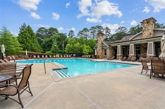 pool with a patio