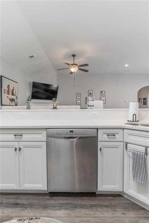 kitchen with dark wood finished floors, light countertops, visible vents, white cabinetry, and dishwasher