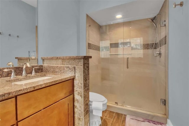 200 Renaissance Pkwy NE Unit 304, Atlanta, GA 30308 - full bathroom with toilet, a shower stall, and vanity