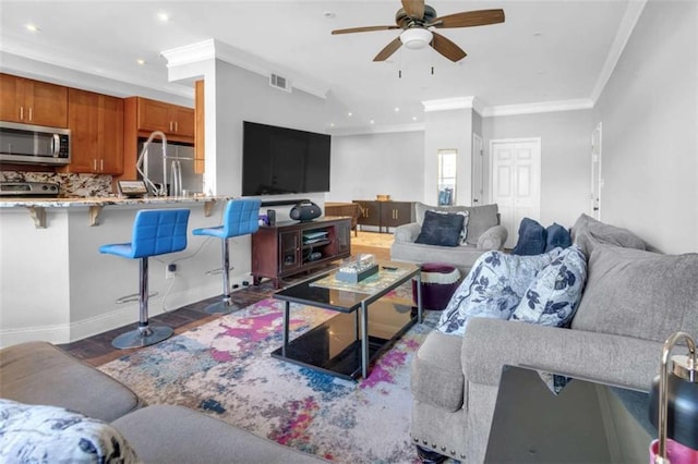 200 Renaissance Pkwy NE Unit 304, Atlanta, GA 30308 - living room with ceiling fan, crown molding, recessed lighting, and wood finished floors
