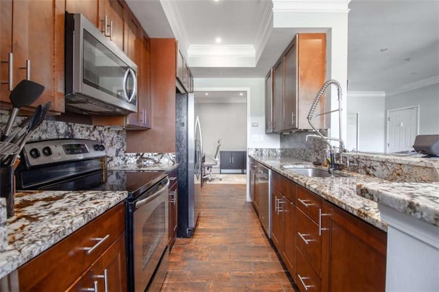 200 Renaissance Pkwy NE Unit 304, Atlanta, GA 30308 - kitchen featuring appliances with stainless steel finishes, dark wood-style floors, a sink, decorative backsplash, and crown molding