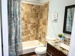 200 Renaissance Pkwy NE Unit 304, Atlanta, GA 30308 - full bath featuring toilet, vanity, and shower / tub combo with curtain