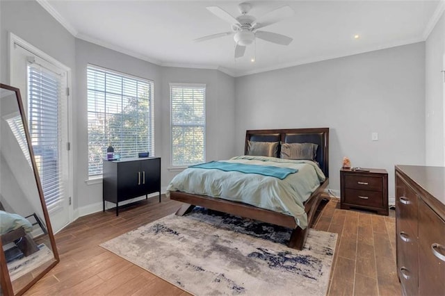 200 Renaissance Pkwy NE Unit 304, Atlanta, GA 30308 - bedroom featuring wood finished floors, ornamental molding, baseboards, access to exterior, and ceiling fan