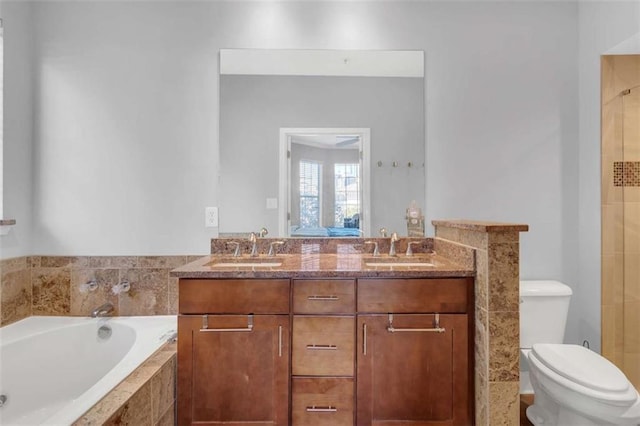 200 Renaissance Pkwy NE Unit 304, Atlanta, GA 30308 - full bath with toilet, a garden tub, and double vanity