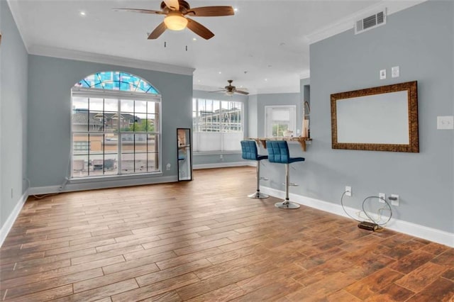 200 Renaissance Pkwy NE Unit 304, Atlanta, GA 30308 - unfurnished living room with ceiling fan, crown molding, baseboards, wood finished floors, and recessed lighting