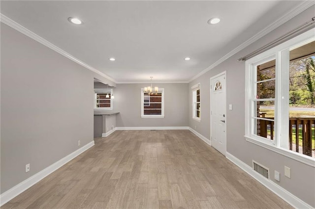 unfurnished living room featuring crown molding, baseboards, recessed lighting, wood finished floors, and a notable chandelier