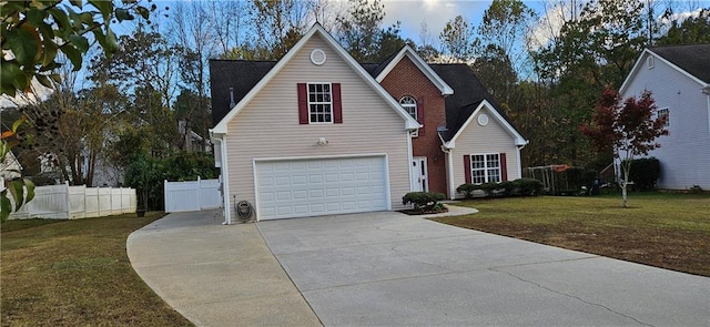 view of front facade with a front yard and a garage