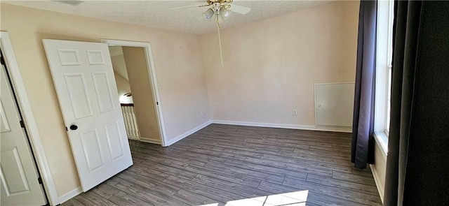 spare room featuring ceiling fan, light hardwood / wood-style floors, and a textured ceiling