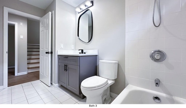 full bath with baseboards, toilet, tile patterned floors, bathtub / shower combination, and vanity