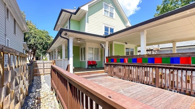 exterior space featuring covered porch and fence