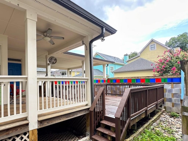 wooden deck with a ceiling fan