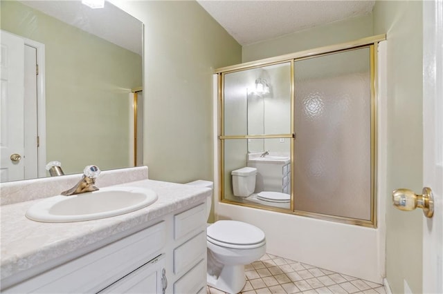 bathroom with tile patterned floors, toilet, a textured ceiling, enclosed tub / shower combo, and vanity