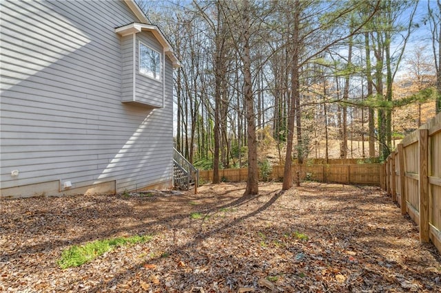 view of yard with a fenced backyard