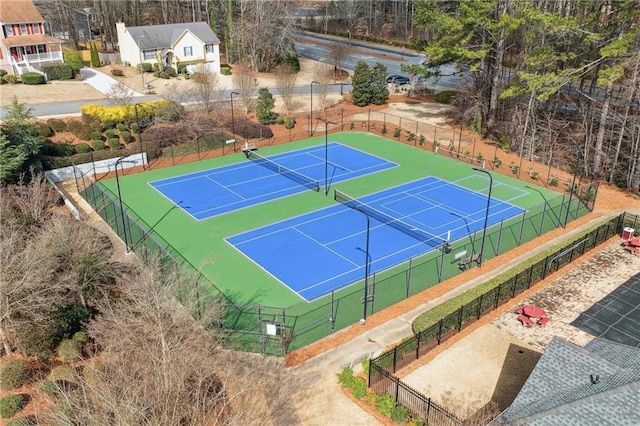 view of tennis court with fence