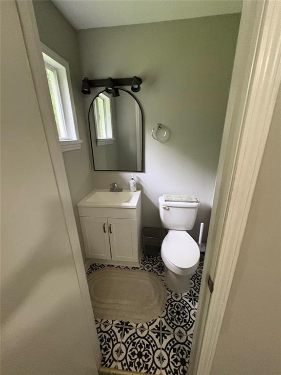 38 Daniel Cir, Franklin, GA 30217 - bathroom featuring vanity, toilet, and tile patterned floors