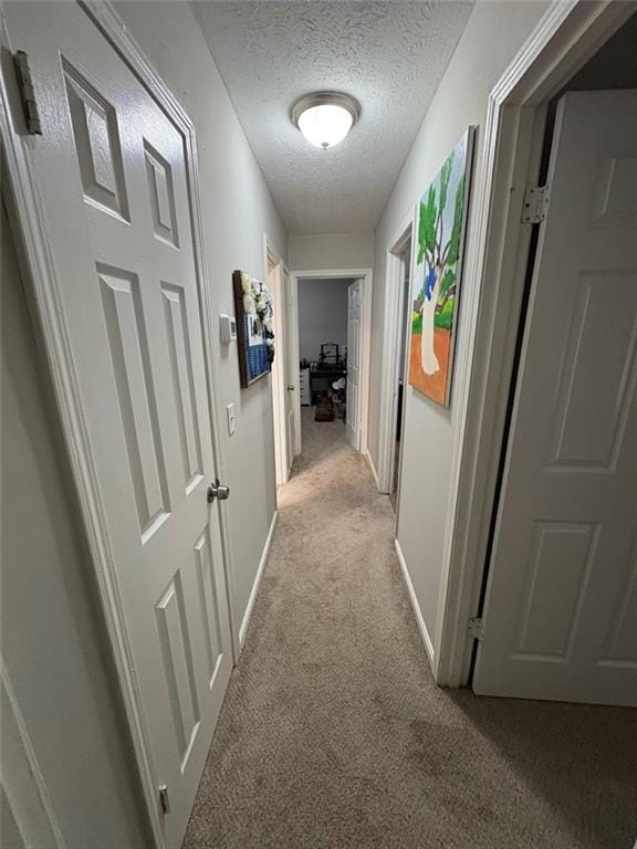38 Daniel Cir, Franklin, GA 30217 - hall featuring light carpet, a textured ceiling, and baseboards