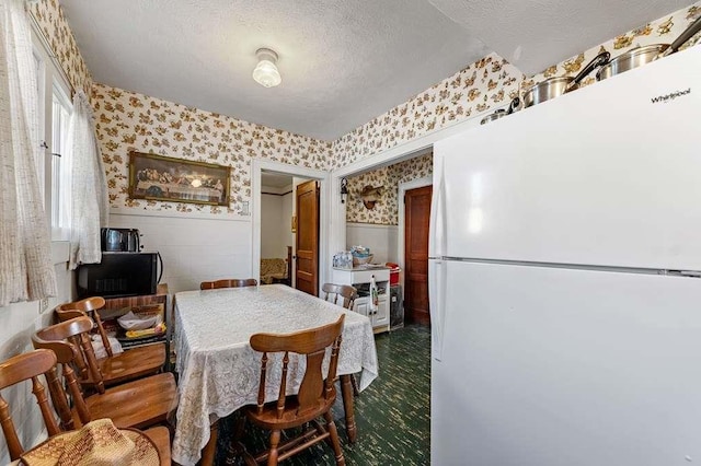 dining room with a textured ceiling