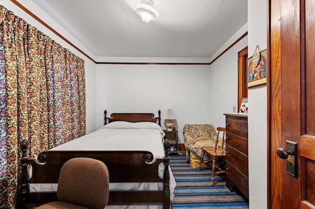 bedroom featuring crown molding