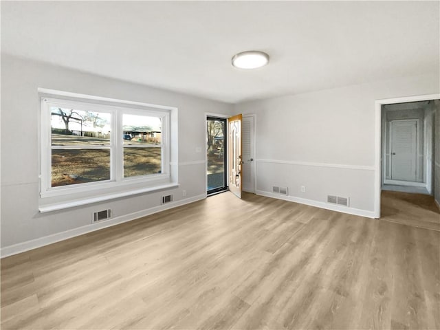 empty room with light wood-type flooring