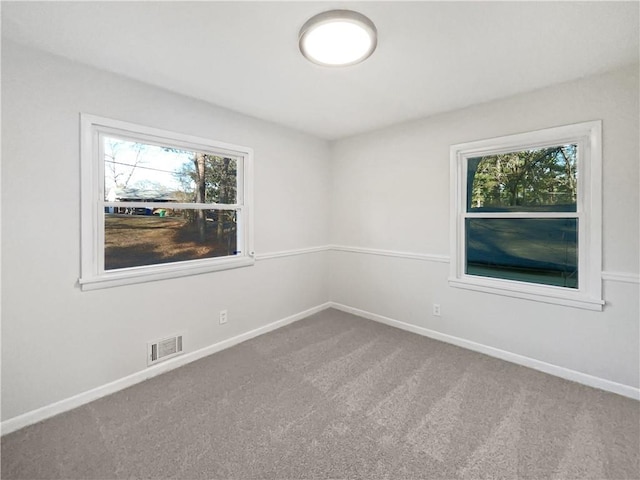 unfurnished room featuring carpet floors