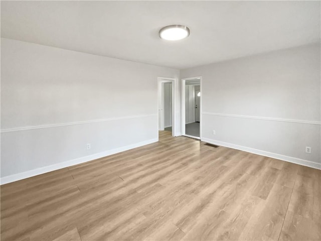 unfurnished room featuring light wood-type flooring