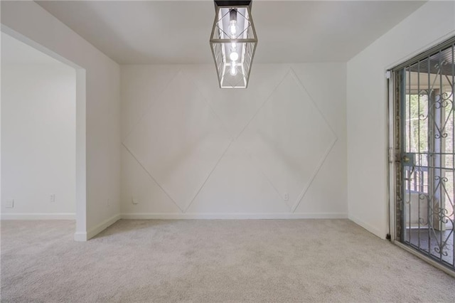 unfurnished dining area with baseboards and carpet floors