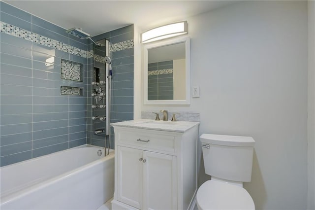 bathroom featuring toilet, vanity, and shower / bath combination