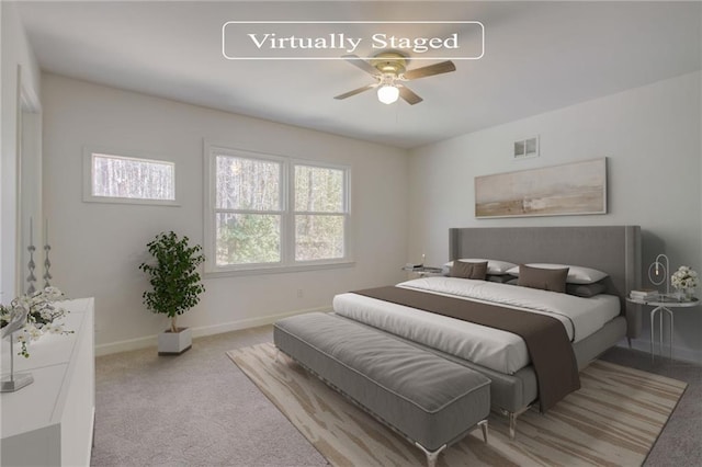 bedroom with visible vents, multiple windows, carpet floors, and baseboards