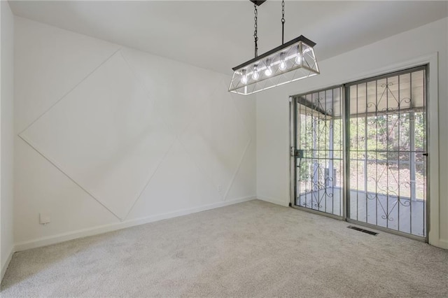 unfurnished dining area with visible vents, carpet, and baseboards
