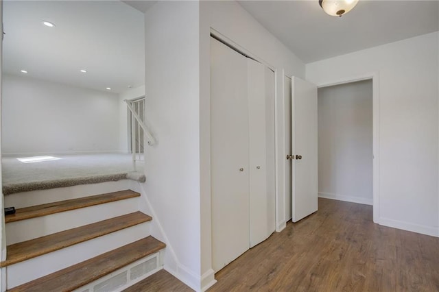 stairs featuring baseboards, recessed lighting, and wood finished floors