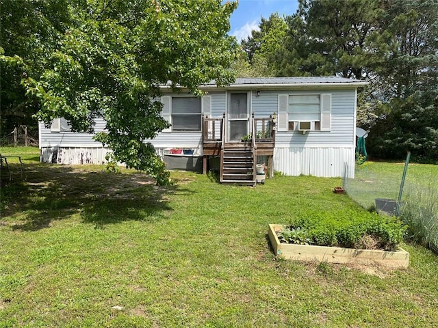 back of house featuring a deck, stairway, cooling unit, a lawn, and metal roof