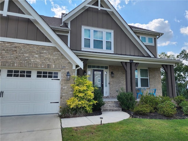 craftsman-style home with a garage, a front lawn, and covered porch