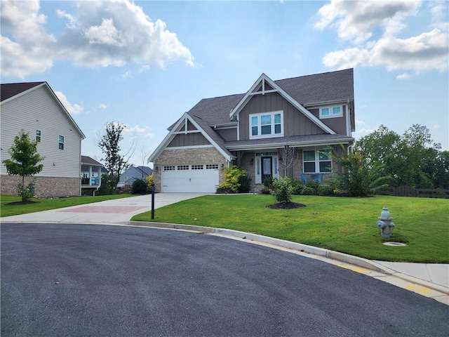 craftsman-style house with a garage and a front lawn