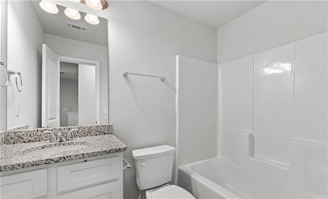 full bathroom featuring shower / tub combination, vanity, and toilet