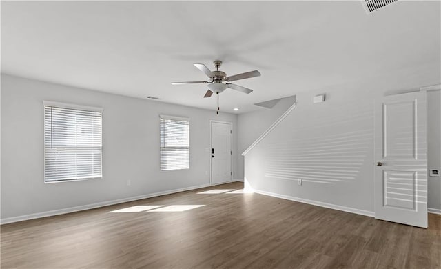 spare room with ceiling fan and dark hardwood / wood-style flooring