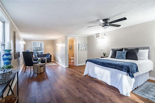 bedroom with dark wood-type flooring, ceiling fan, ornamental molding, and a textured ceiling