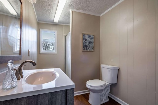 bathroom featuring walk in shower, toilet, wood-type flooring, a textured ceiling, and vanity