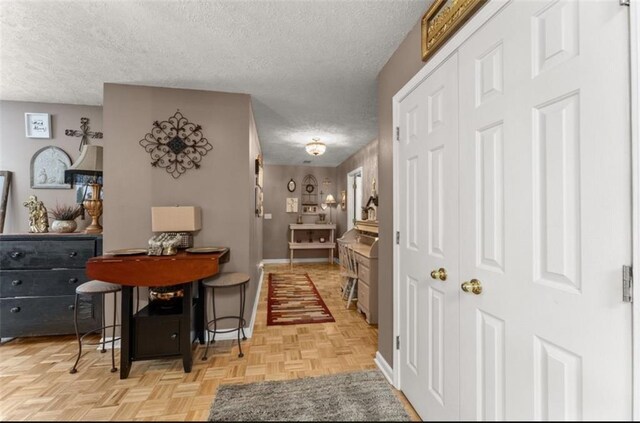 6045 Mockingbird Rd, Cumming, GA 30028 - hall featuring a textured ceiling and baseboards