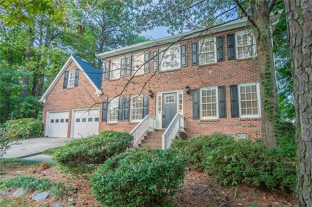 colonial inspired home with a garage