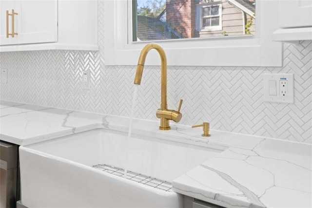 interior details with decorative backsplash and a sink