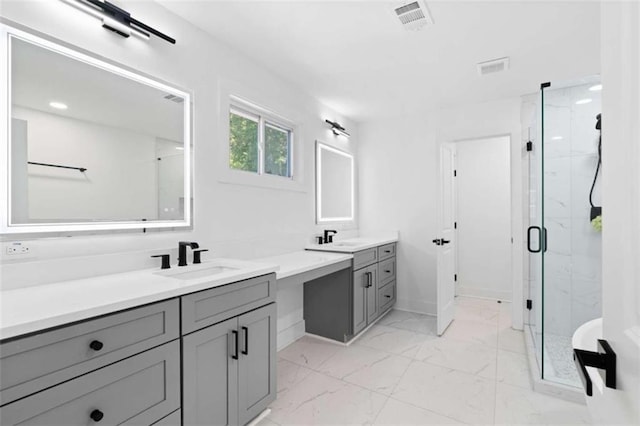 full bath with marble finish floor, a marble finish shower, a sink, and visible vents